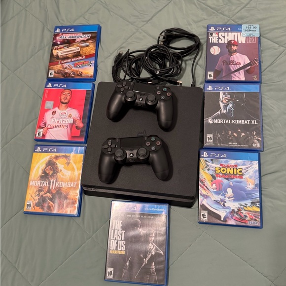 Sony PlayStation 4 Console with Black Controllers and Game Bundle